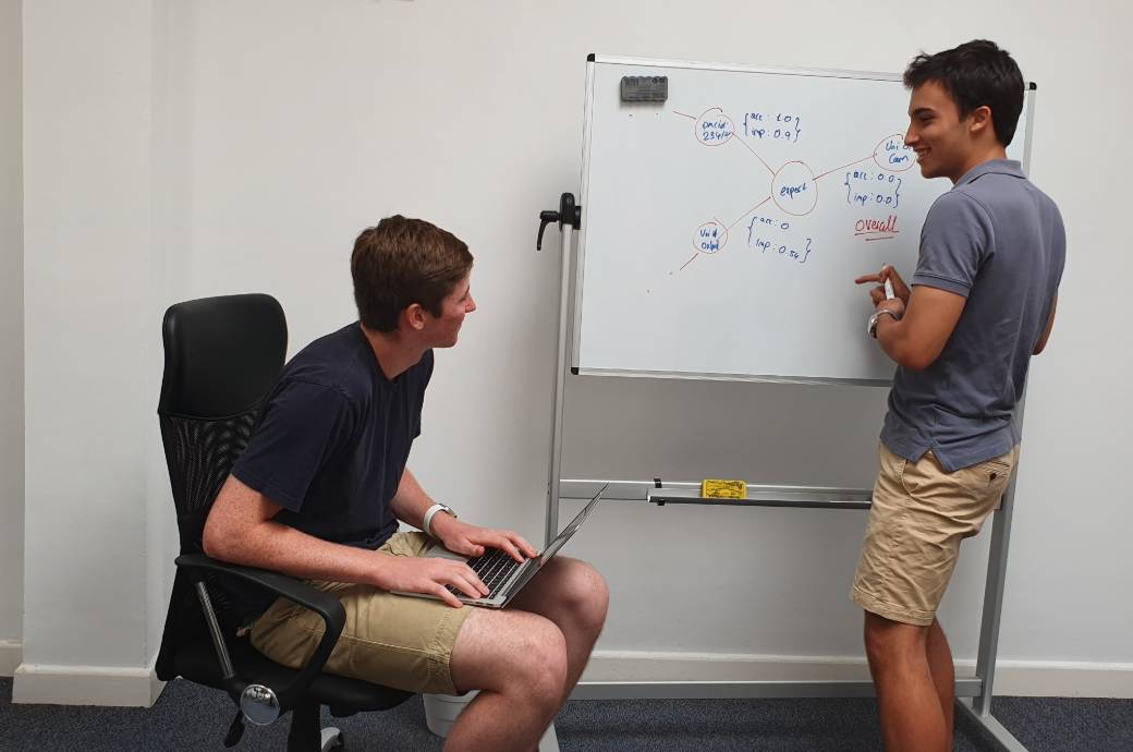 Interns brainstorming on whiteboard