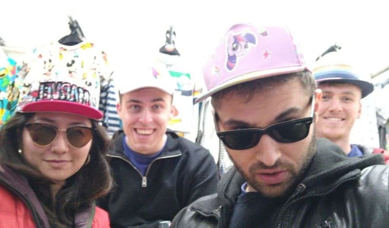 A picture of Ayaka and Luke (left to right in the front) and Will and Jack (left to right at the back) wearing hats.